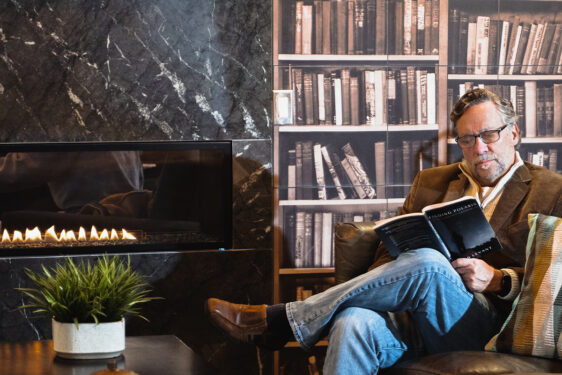 Man reading a book in the interior lounge